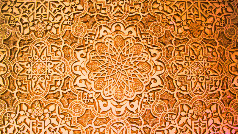 intricate arabesque wall carving