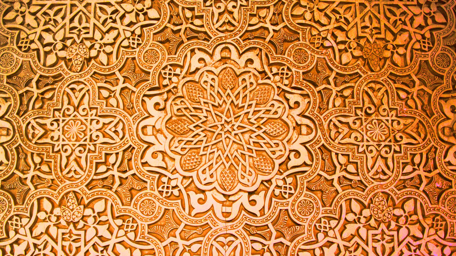 intricate arabesque wall carving