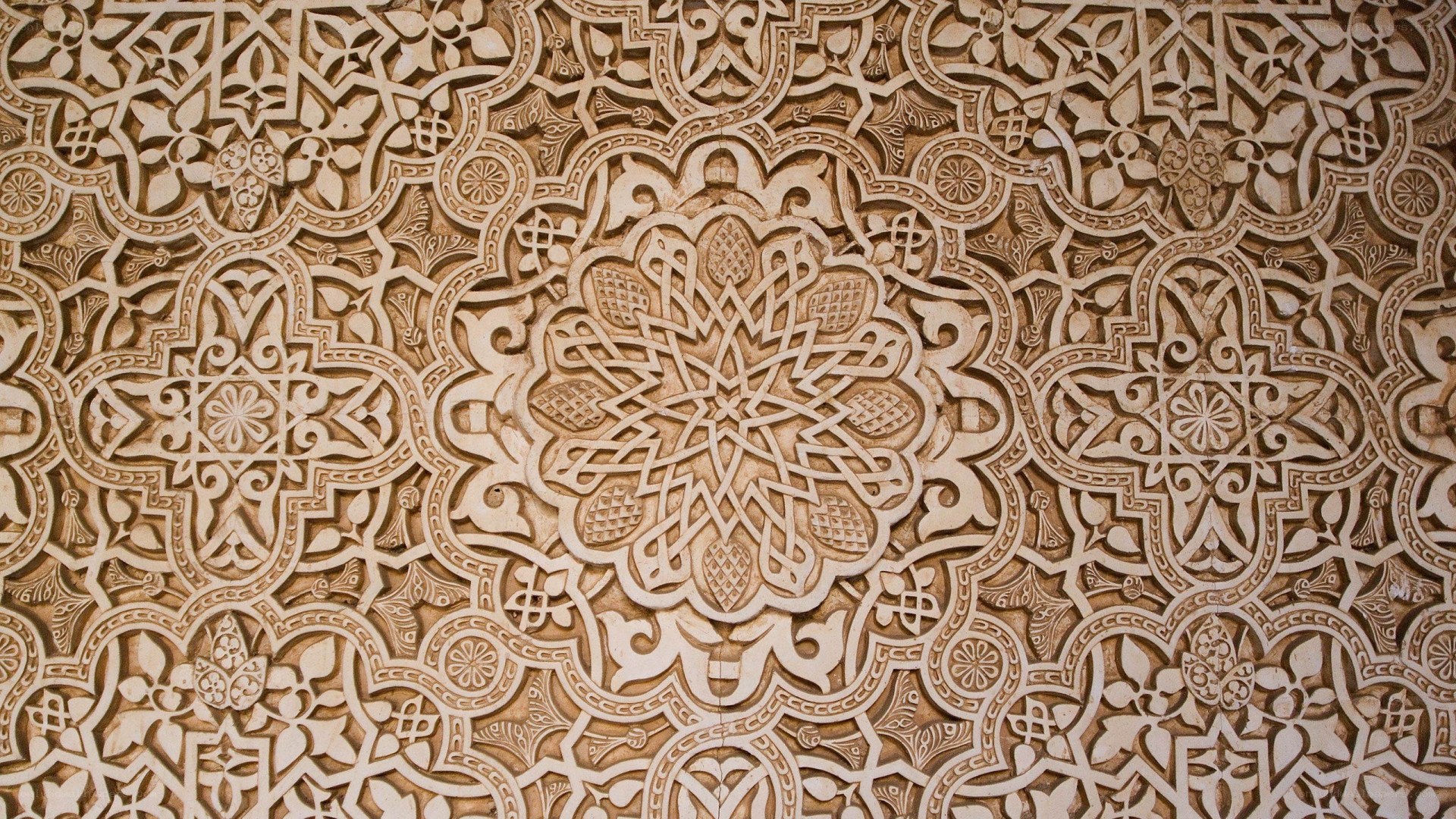 intricate arabesque wall carving