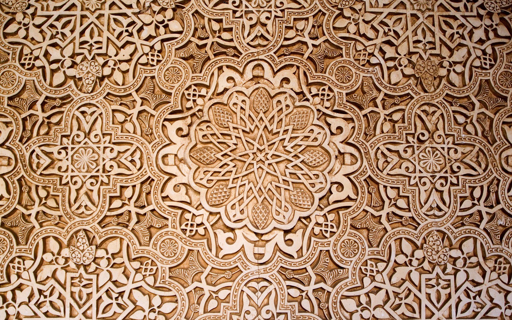 intricate arabesque wall carving