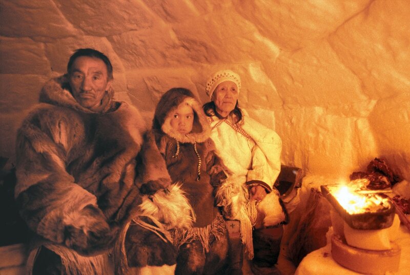 Inuit family in an igloo
