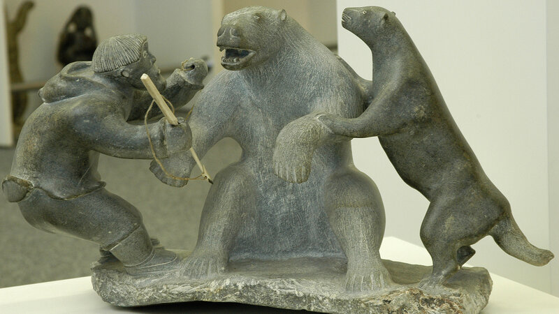 Inuit sculpture of hunter and bears