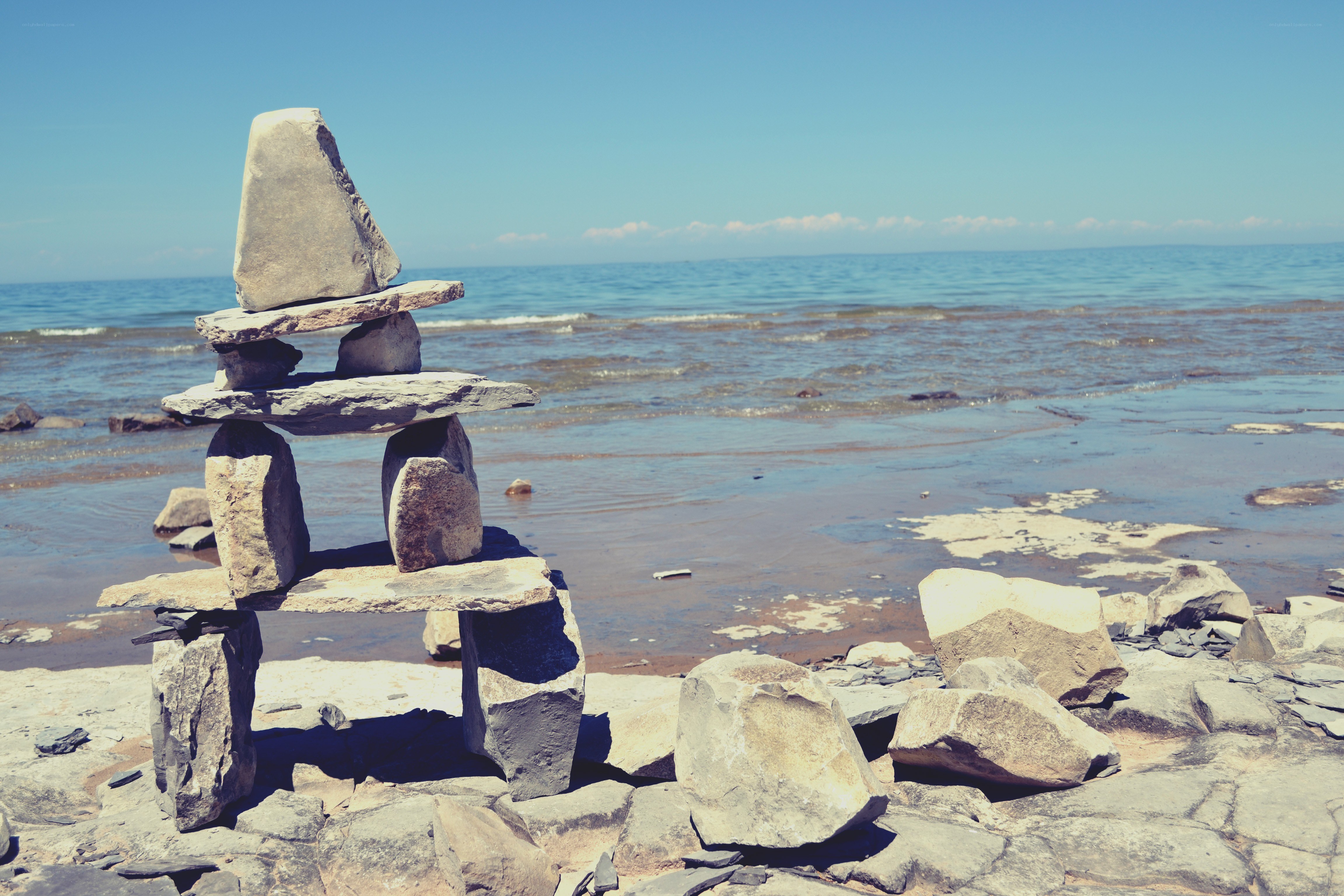 Inukshuk on a sunny beach