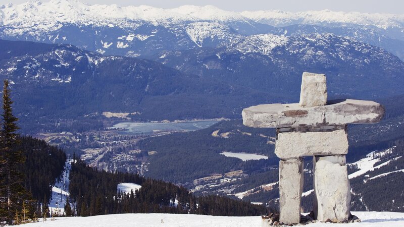 Inukshuk on snowy mountain