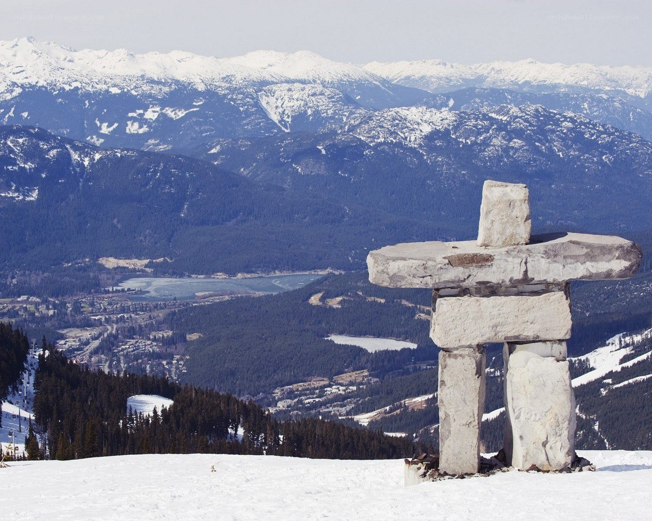 Inukshuk on snowy mountain