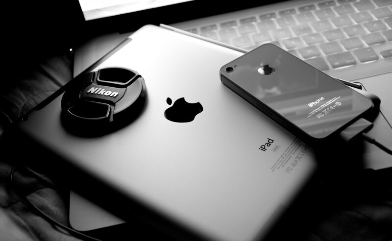 IPad and IPhone on Laptop — Black, Dramatic