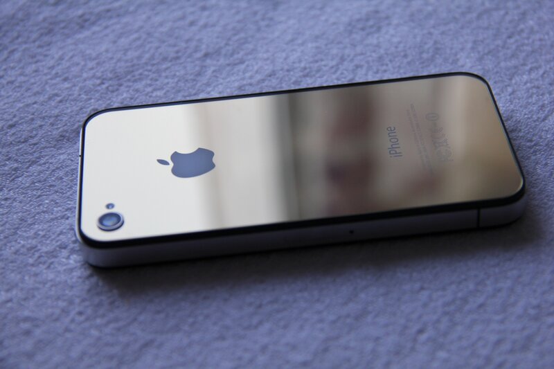 iPhone 4 on a blue surface