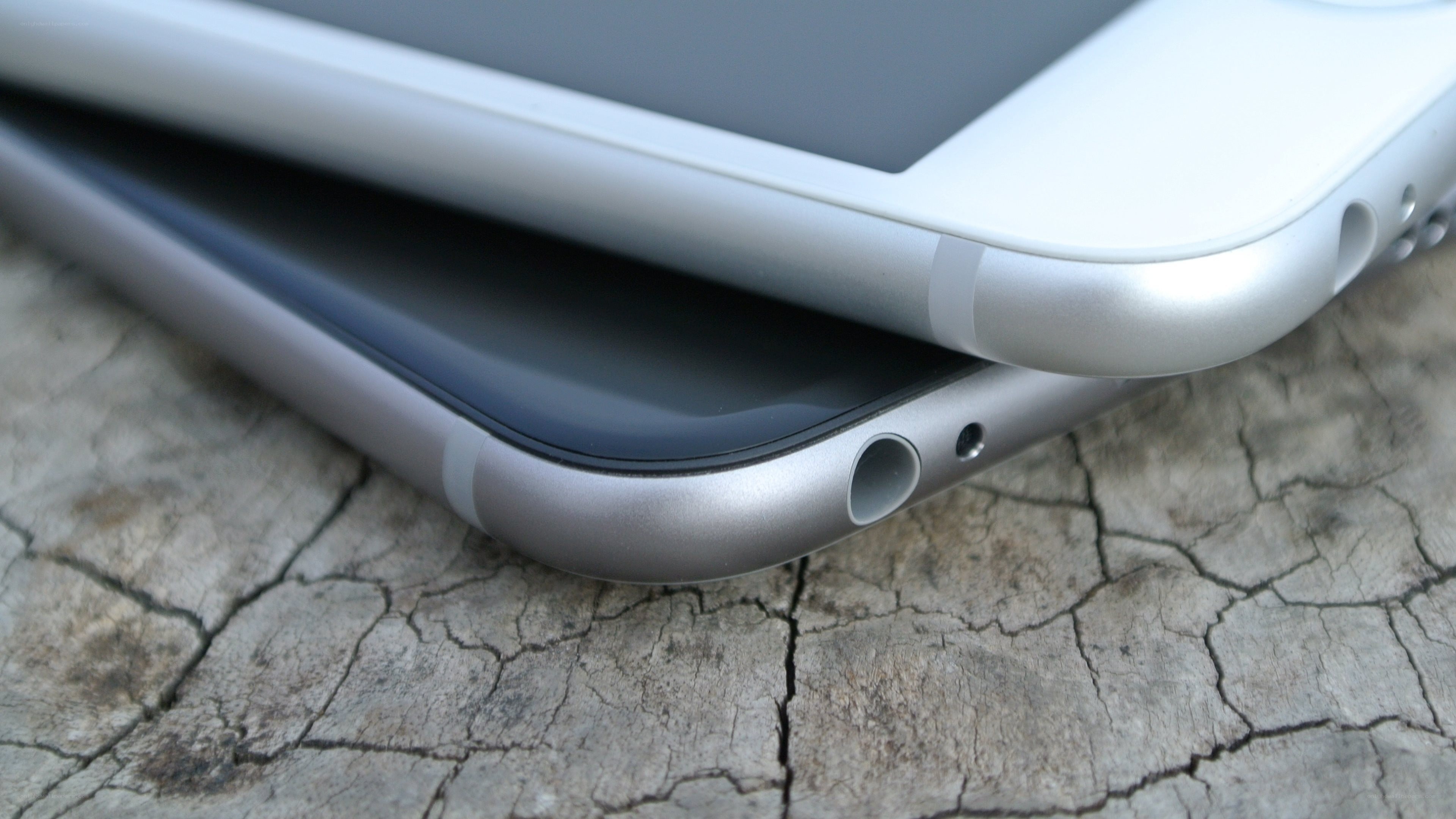 iPhone devices on wood