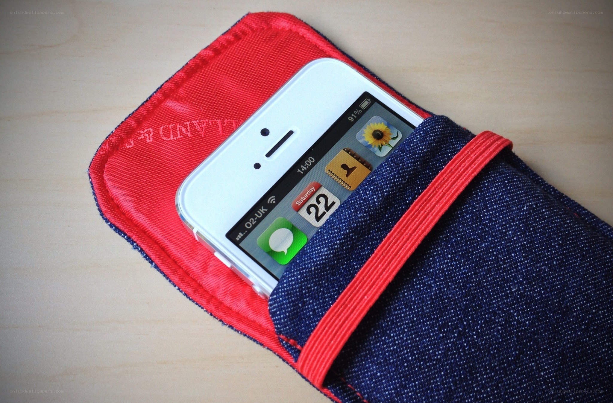 iPhone in denim pouch