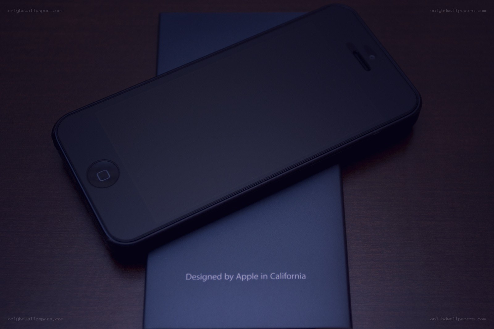 iPhone on box in dark room