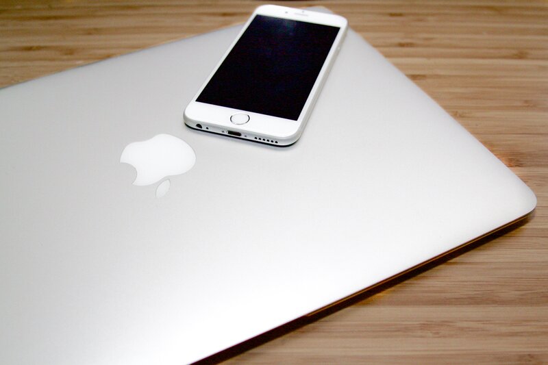 iPhone on MacBook laptop