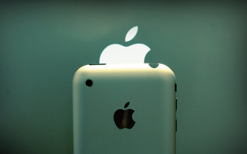 iPhone with Apple logo projection