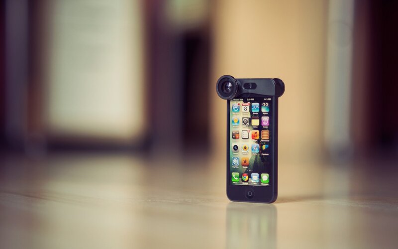 iPhone with camera lens attachment