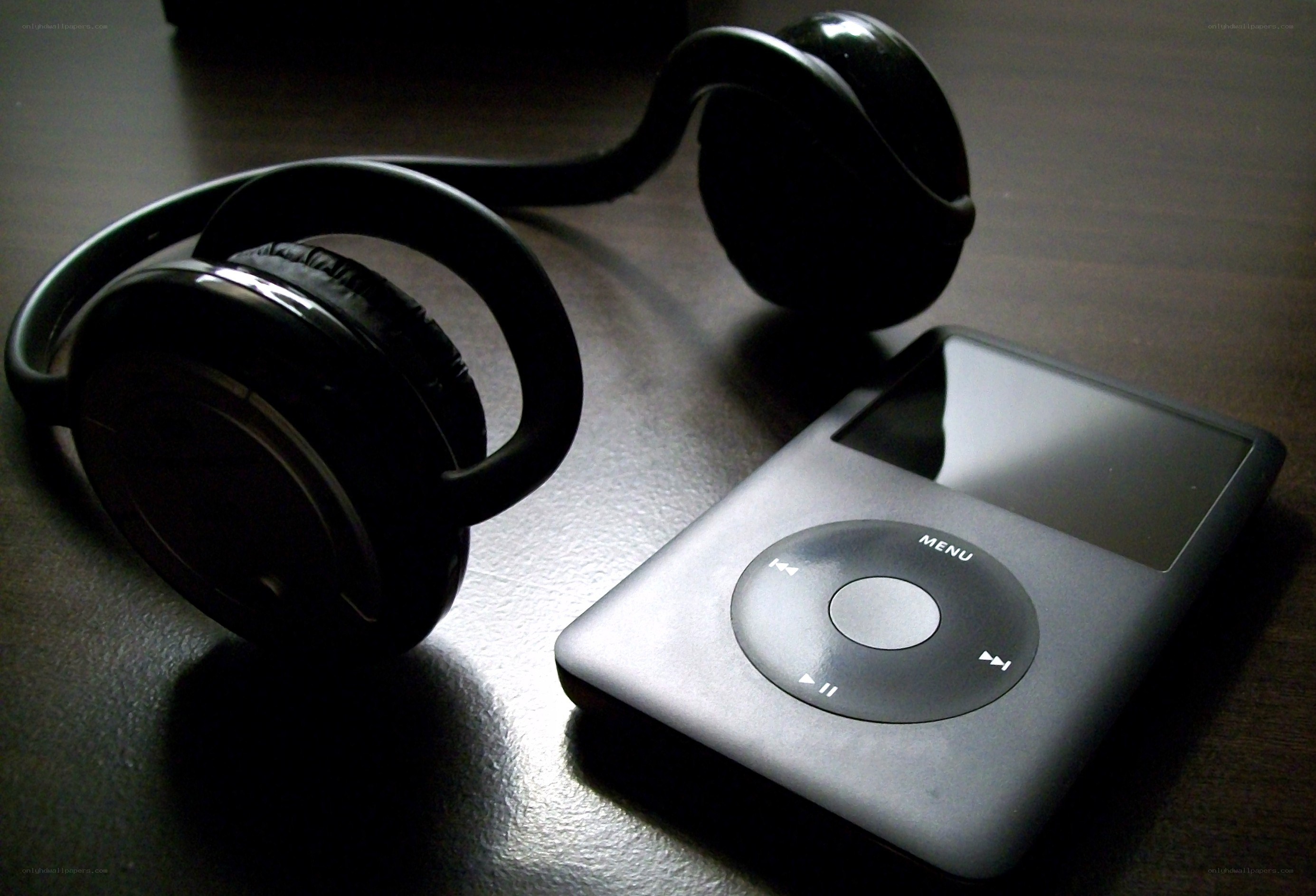 iPod and headphones on table