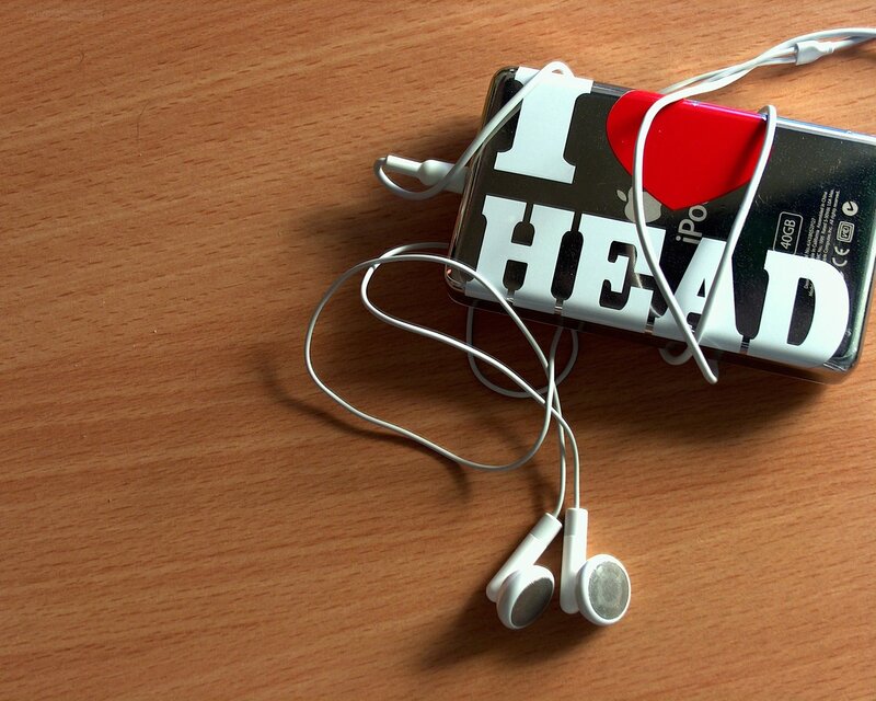 iPod with headphones on table