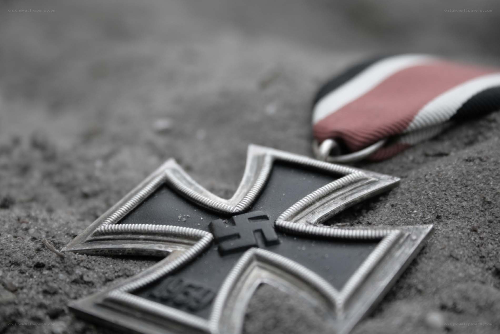 Iron Cross medal on sand