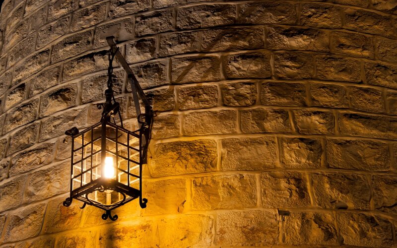 Iron Lantern on Stone Wall