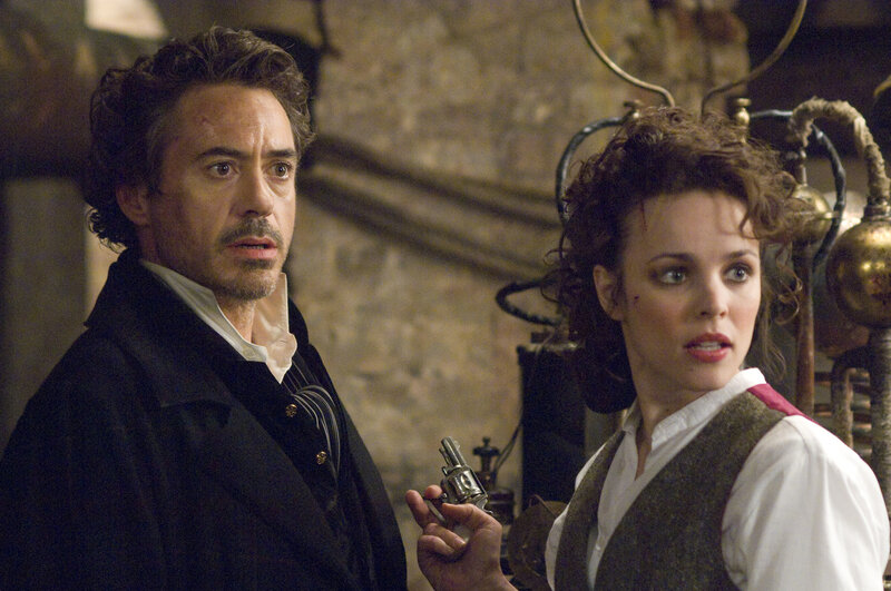 Iron Man and a woman in a workshop