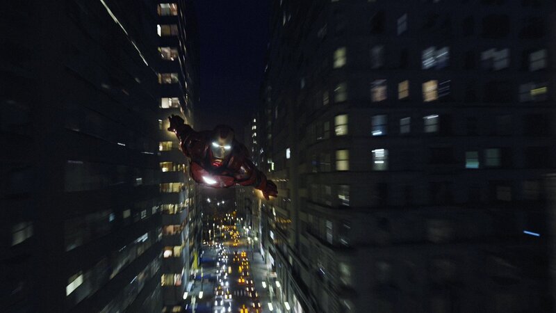 Iron Man flying over city