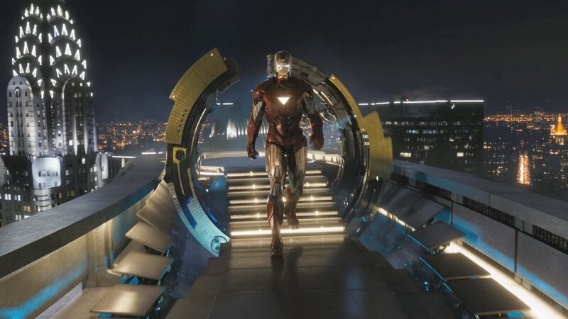 Iron Man on a rooftop at night
