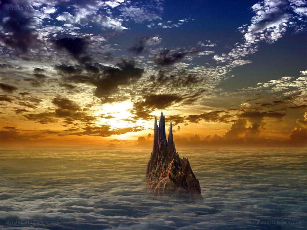 Island above the clouds at sunset