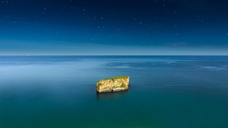Island at night under stars