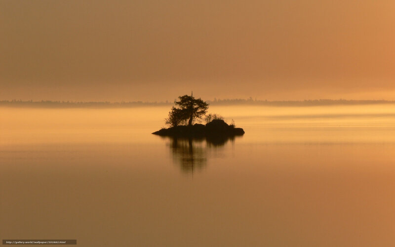 Island at sunrise in mist