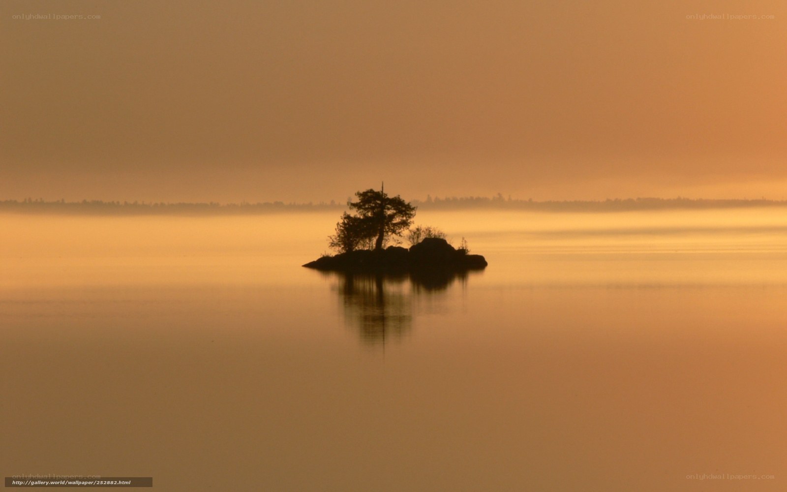 Island at sunrise in mist