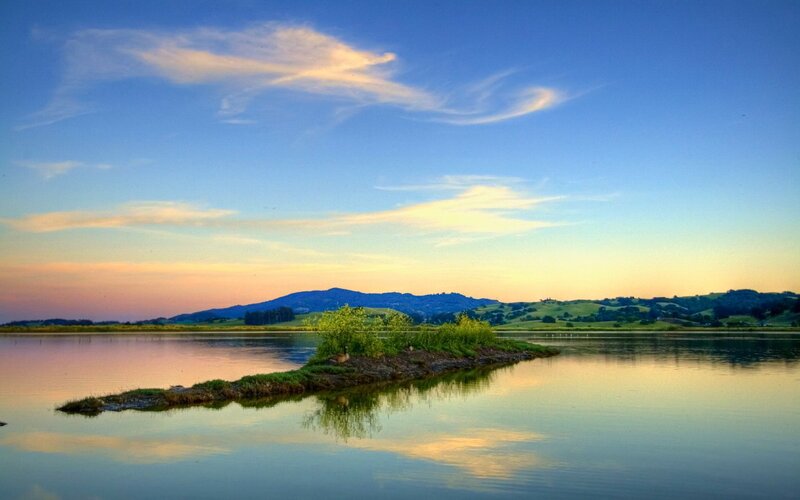 Island at sunset in a calm lake