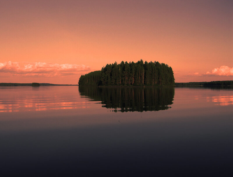 Island at sunset on a calm lake