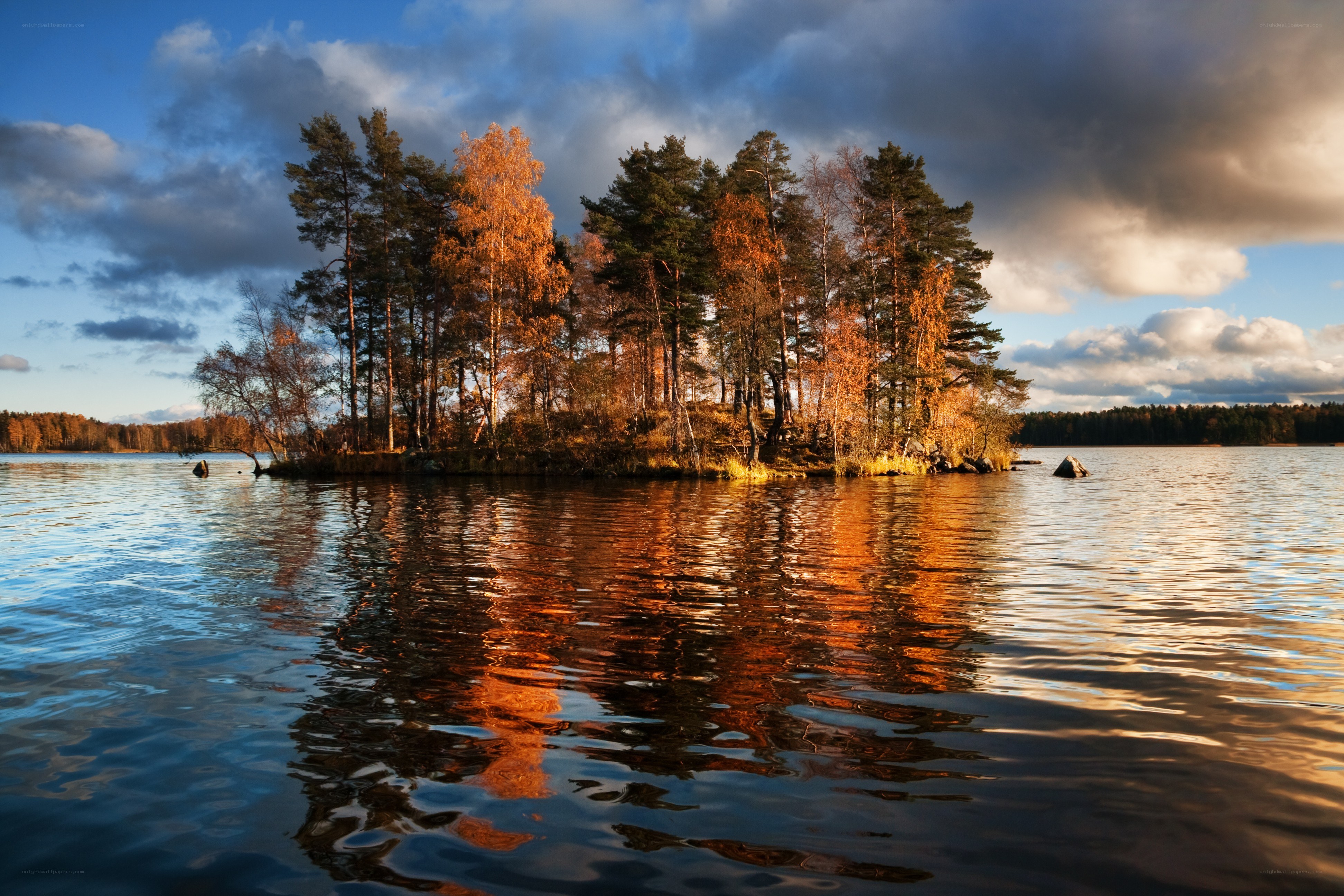 Island at sunset with autumn trees