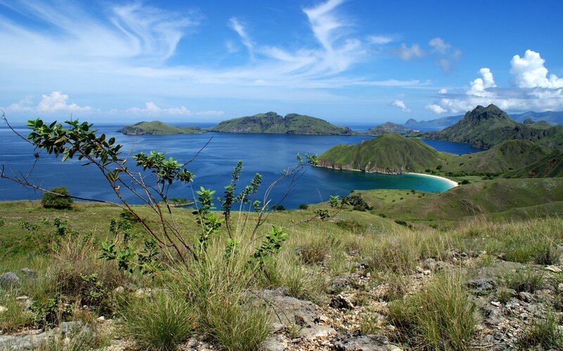Island bay with green hills