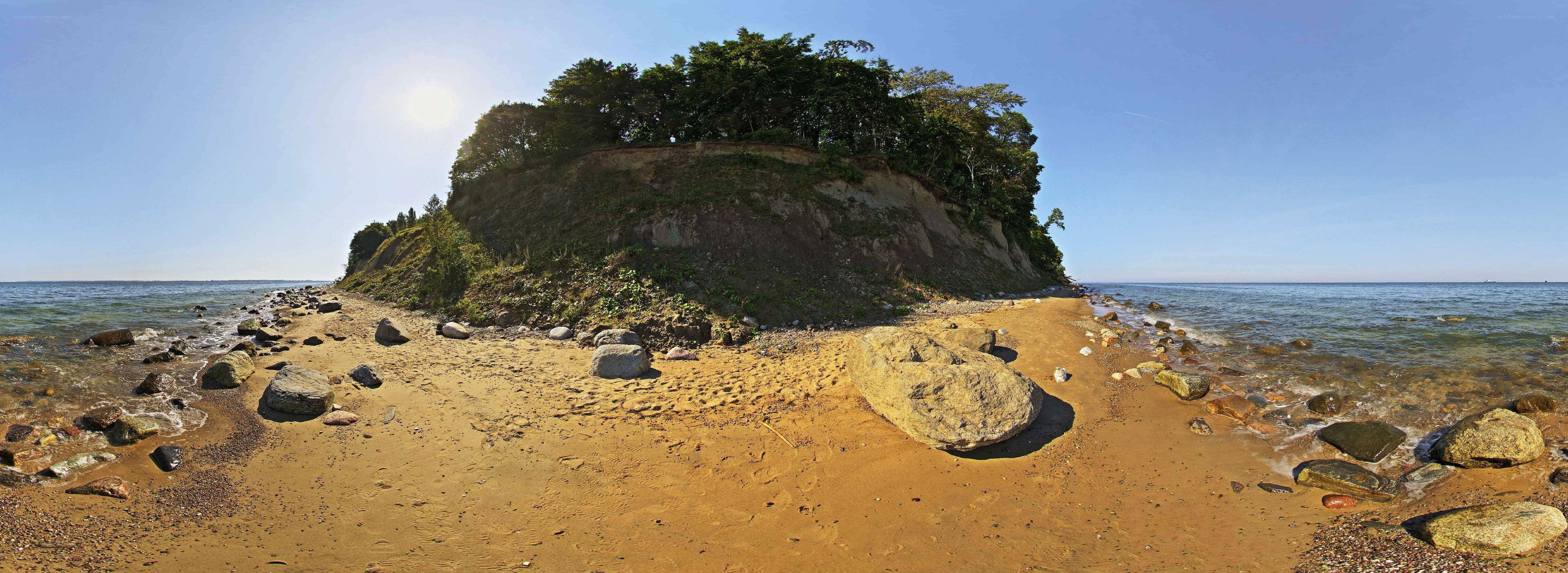 Island beach with rocks and trees