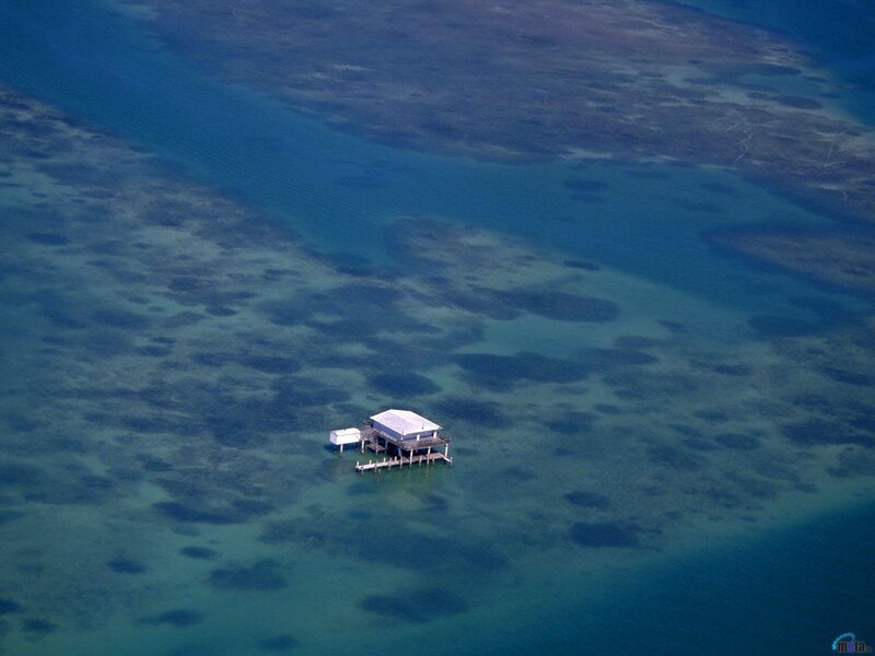 Island house in clear blue water