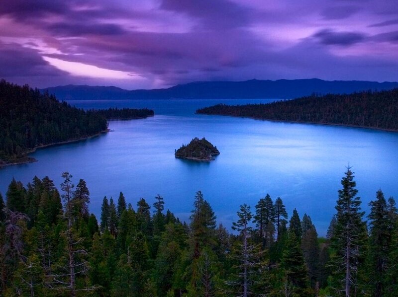 Island in a blue lake at dusk