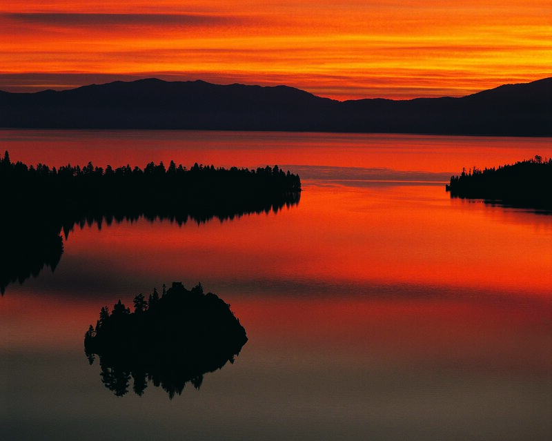 Island in Lake at Sunset — Orange, Serene, Photograph, Mountains, Trees, Sky