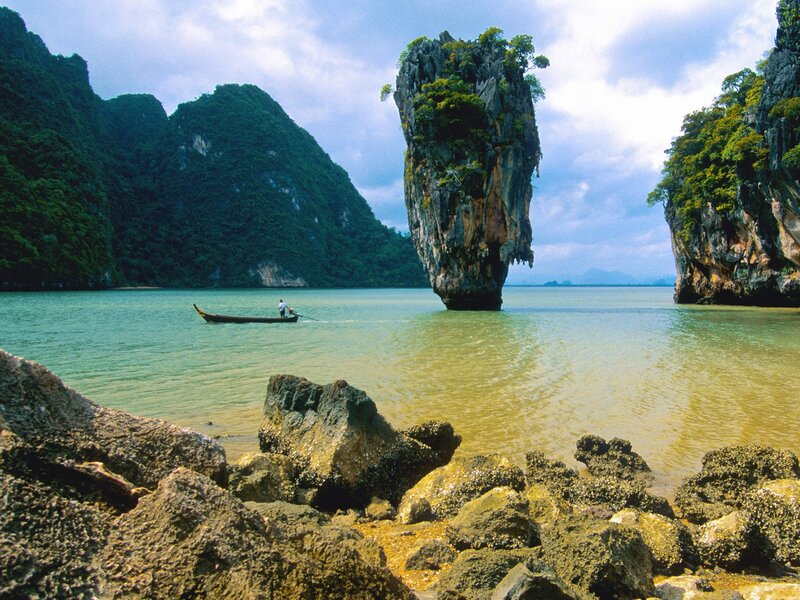 Island in the sea with boat
