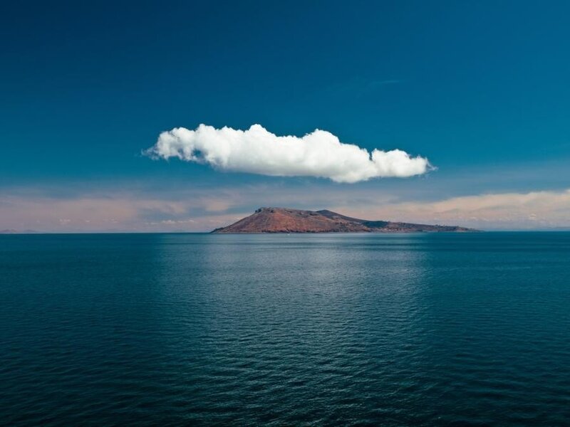 Island under a single cloud
