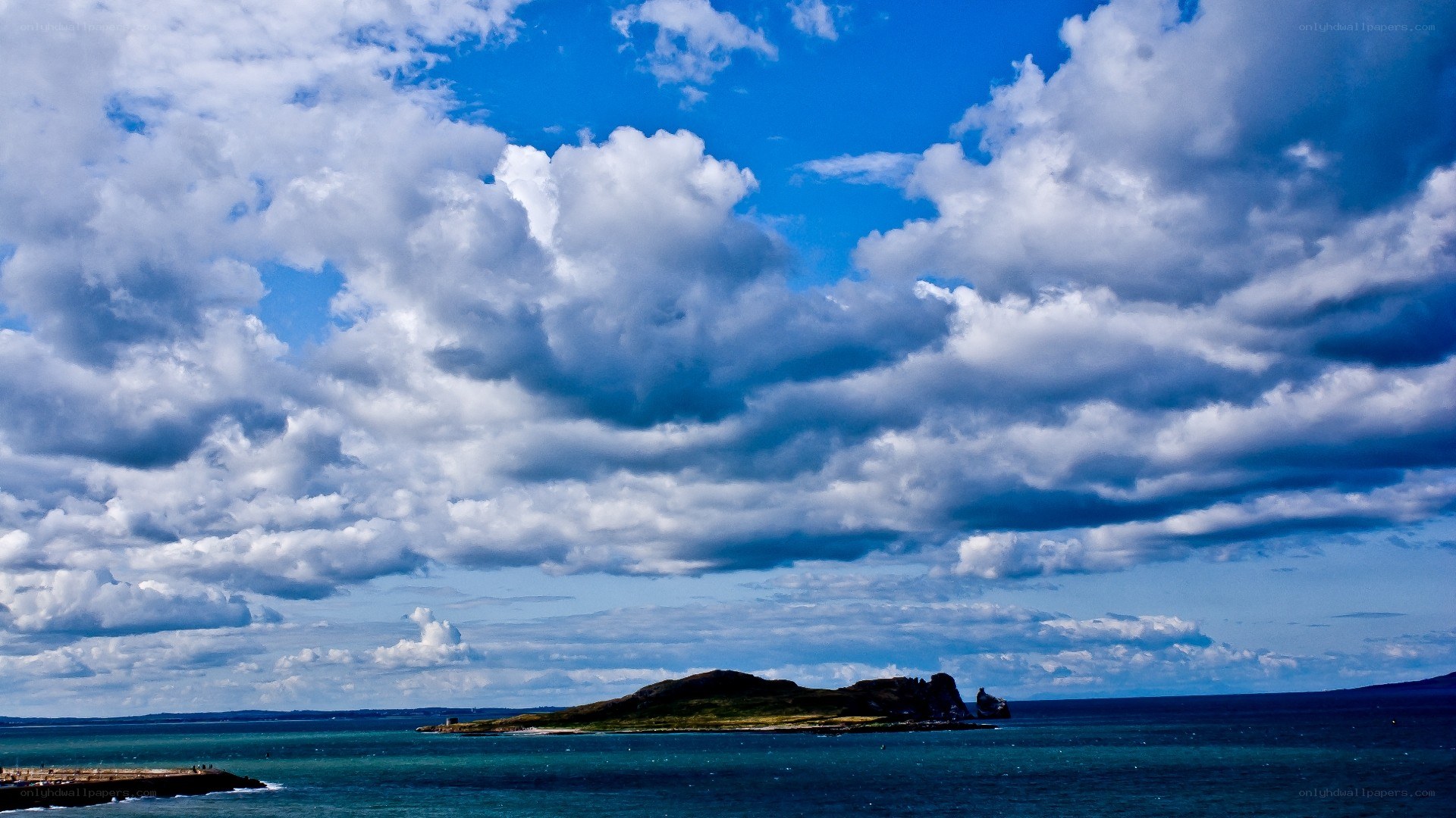 Island under cloudy sky