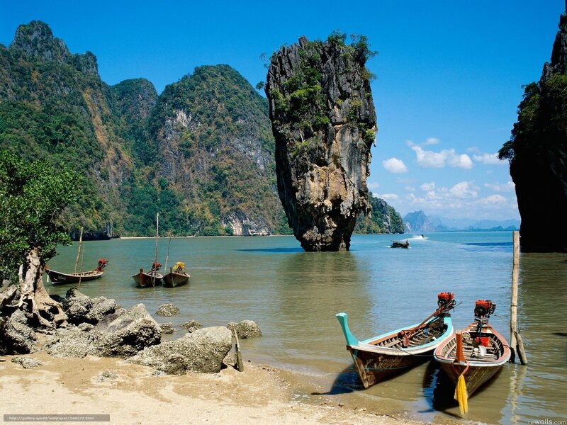 Island with boats in Thailand