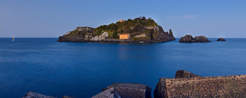 Island with buildings in the sea