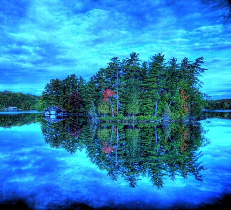 Island with cabin on lake