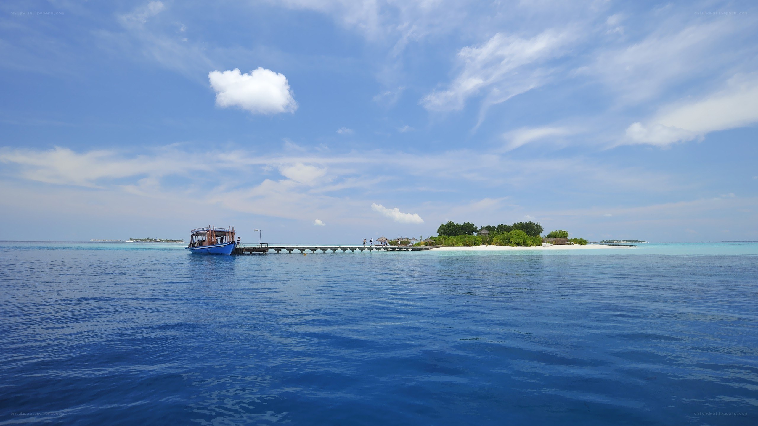 Island with dock and boat
