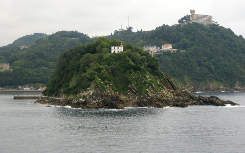 Island with white building in bay