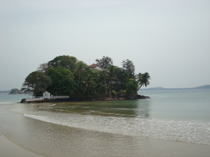 Island with white house and pier