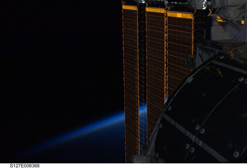 ISS solar arrays over Earth