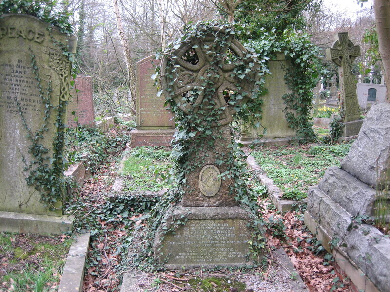 Ivy-covered gravestones in a cemetery