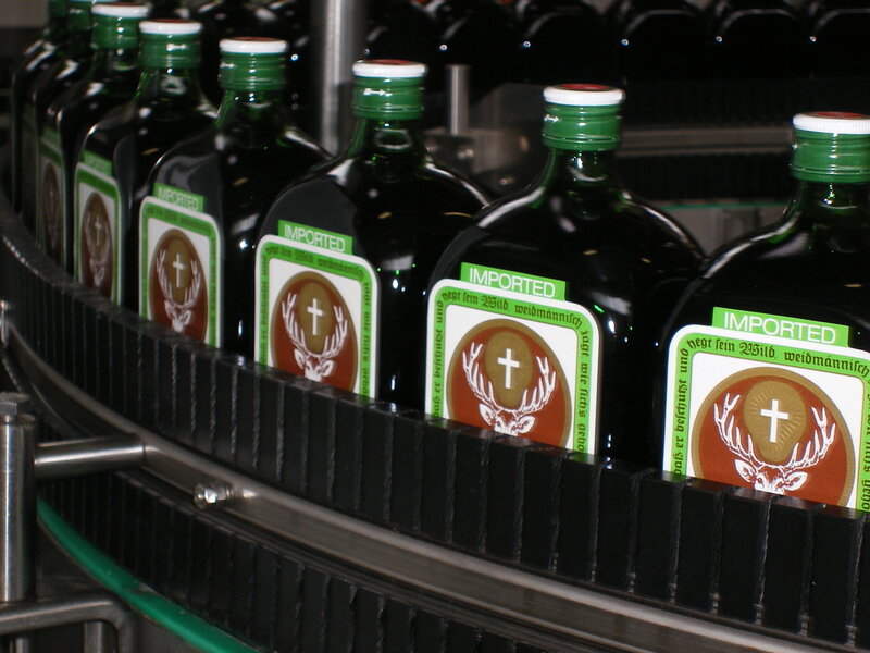 Jägermeister bottles on conveyor belt
