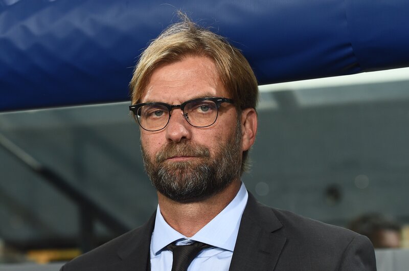 Jürgen Klopp in suit and glasses