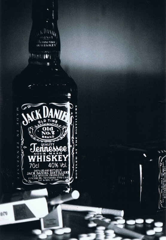 Jack Daniel's bottle with cigarettes